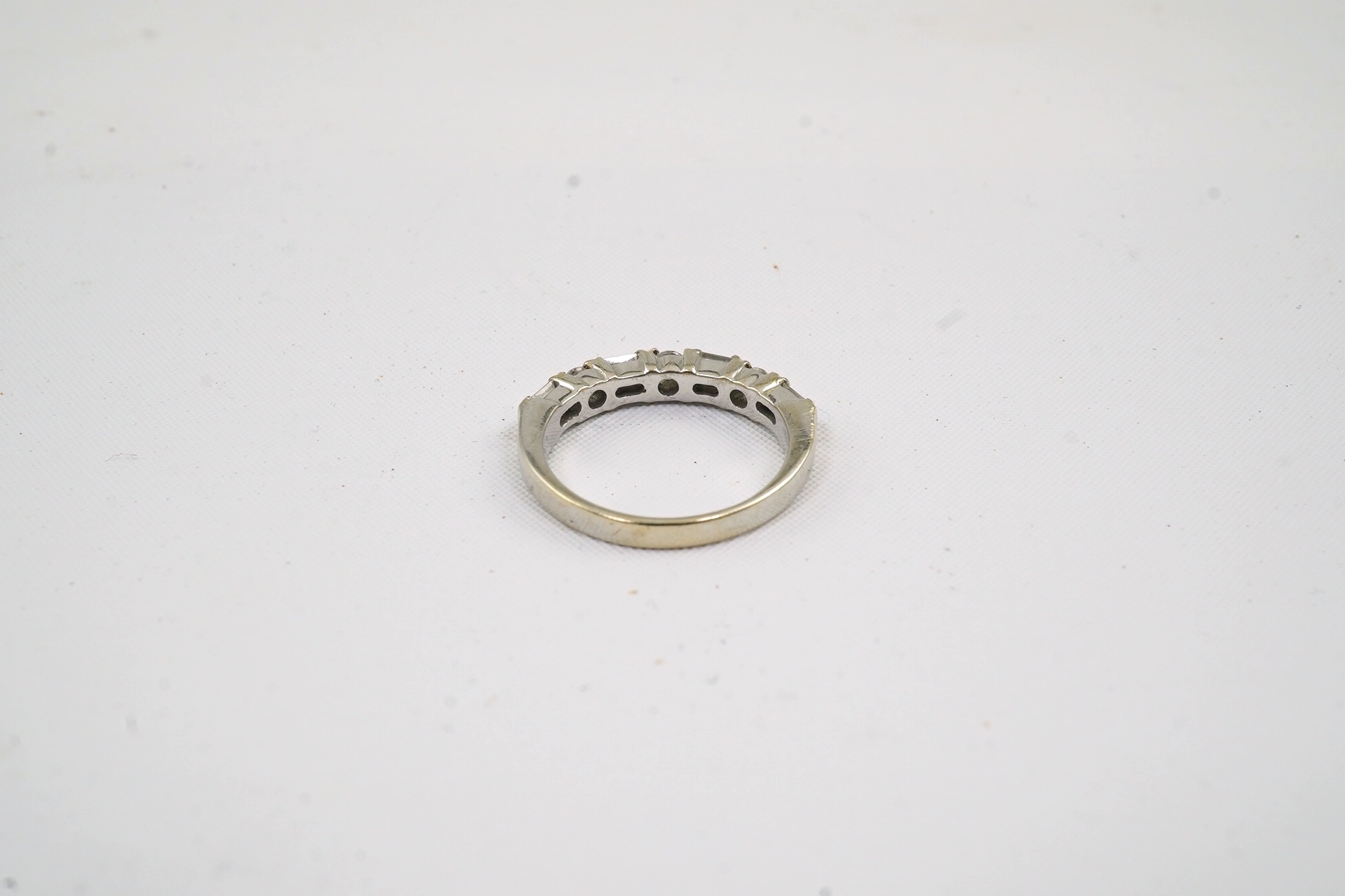 A modern white gold?, baguette and round cut diamond cluster set half hoop ring